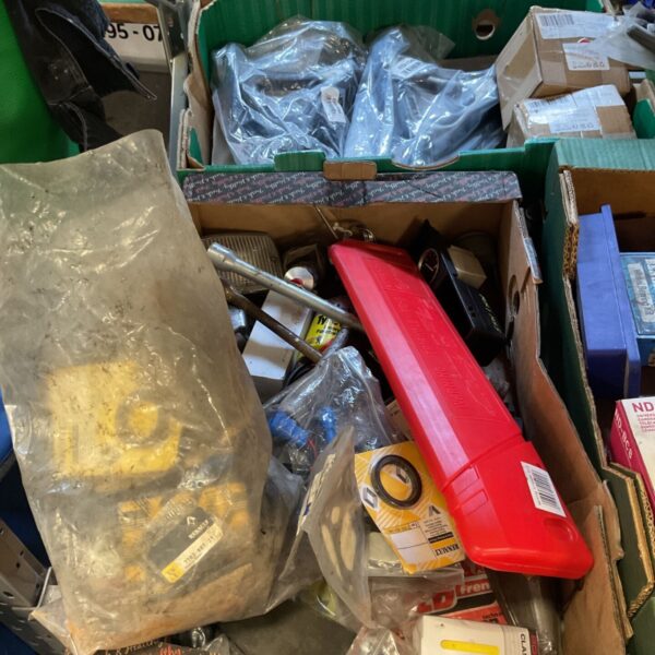 Mixed lot of automotive tools with a Toyota sign inside a green box.