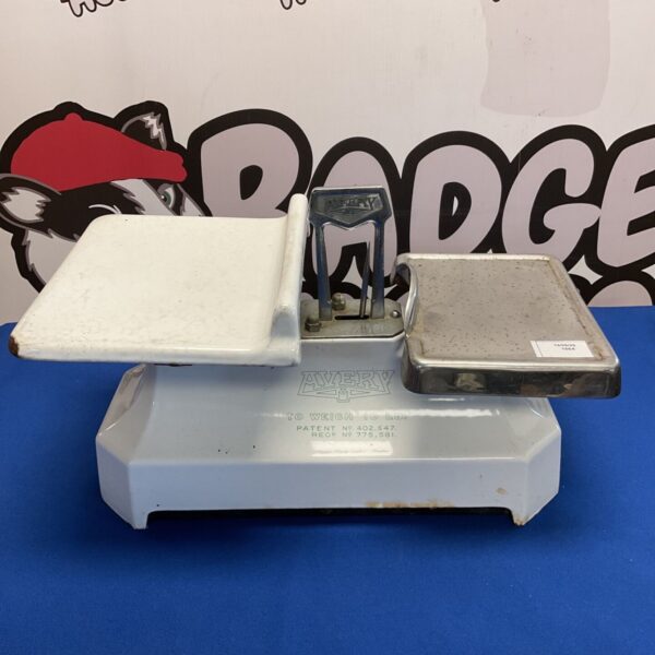Vintage Avery cast iron scales with enamel finish, a classic kitchen collectible.