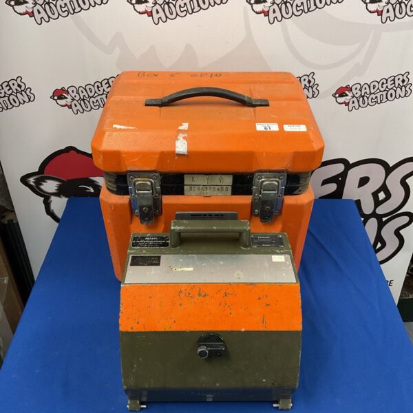 Orange Aviophot RC10 film canister with gauges and clasps.