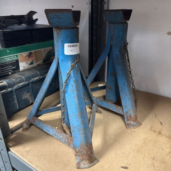 Pair of used axle stands for vehicle repair and maintenance.