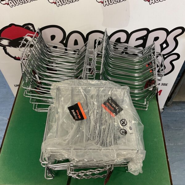 Large quantity of stainless steel Backyard rib racks for BBQ grilling.