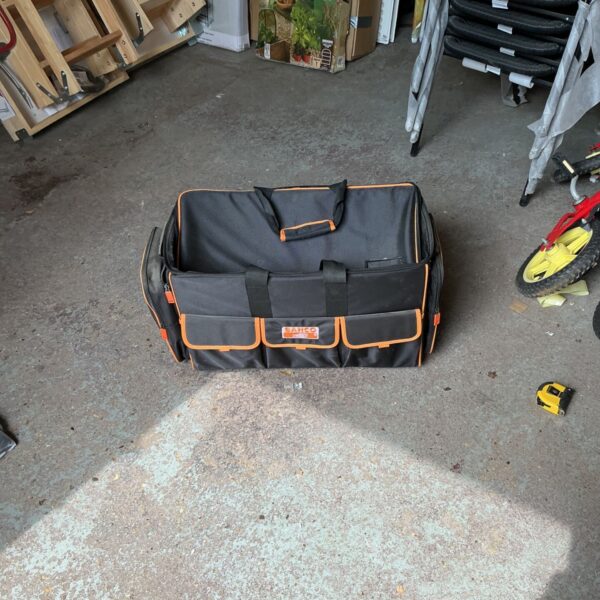 Front view of a used Bahco tool bag with multiple pockets.