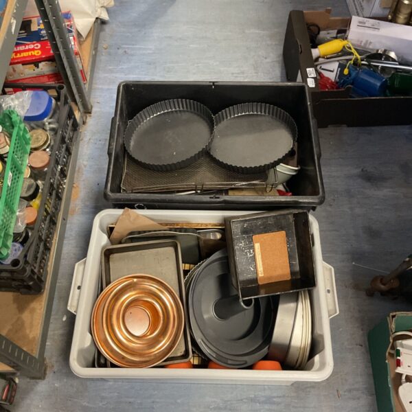 Assorted baking and cooking trays including cake tins and roasting pans.
