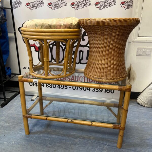 Vintage bamboo table and two matching stools in a home setting.
