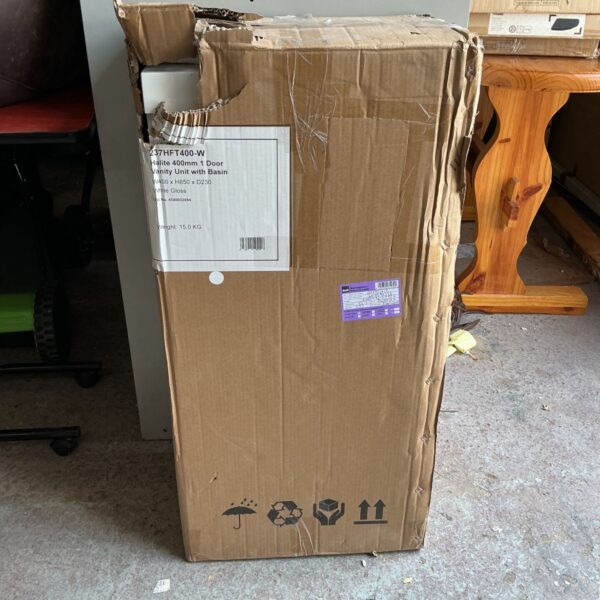 Bathroom vanity unit HT400-W with basin, showing signs of wear.