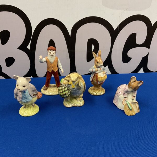 Beatrix Potter figurines collection including Peter Rabbit and Mr McGregor.
