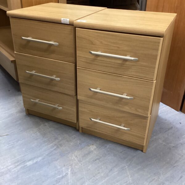 Pair of vintage wooden bedside cabinets with three drawers.
