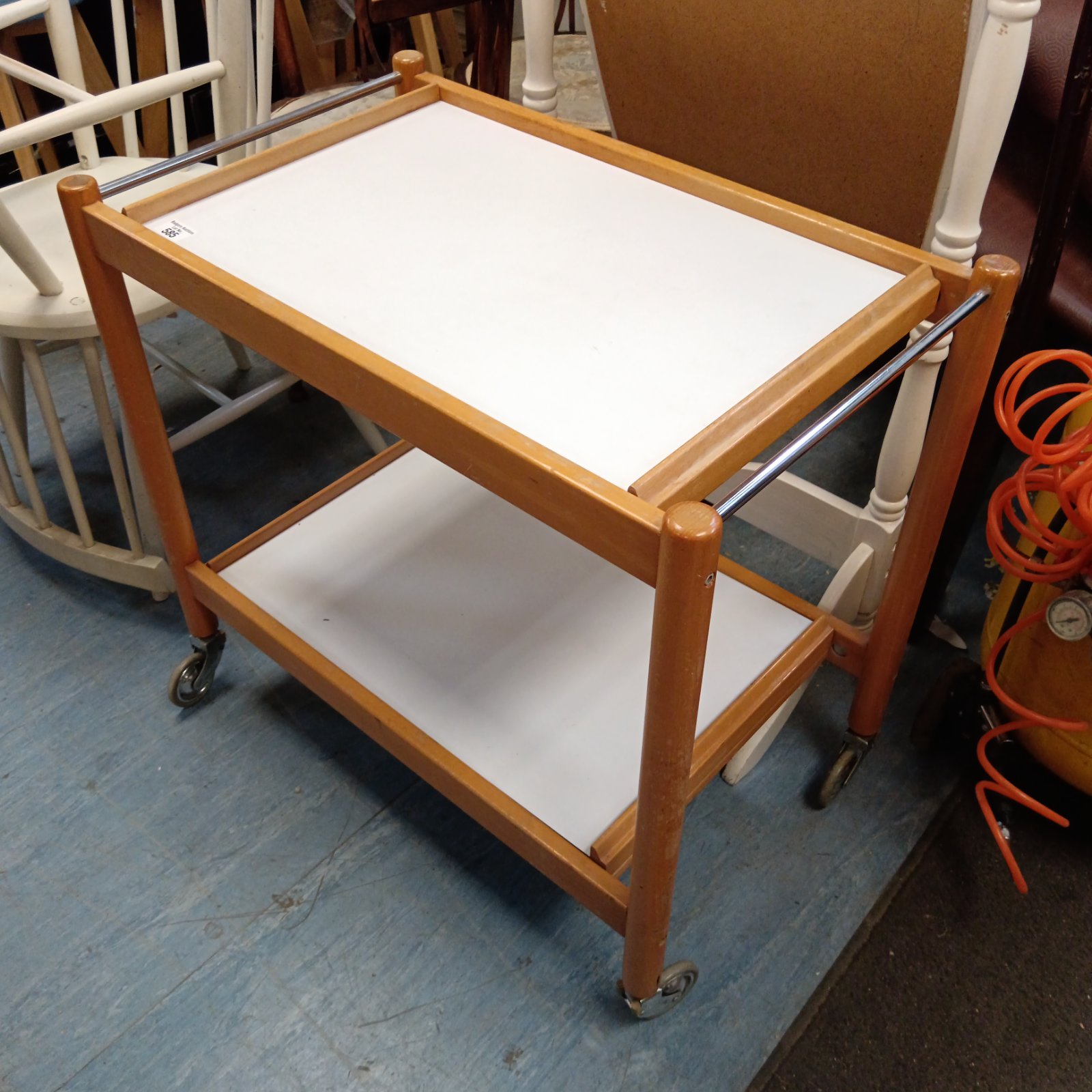 Vintage beech butlers trolley with two tiers and chrome handles.