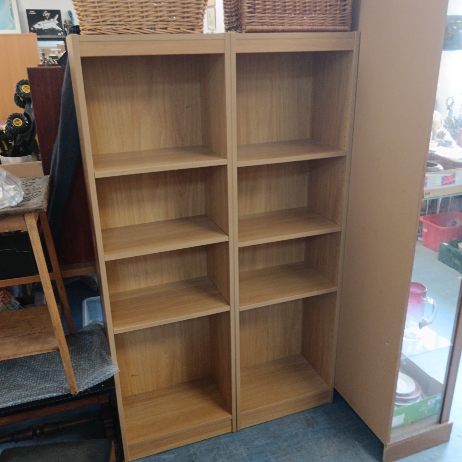 Pair of vintage beech effect tall bookcases for home storage.