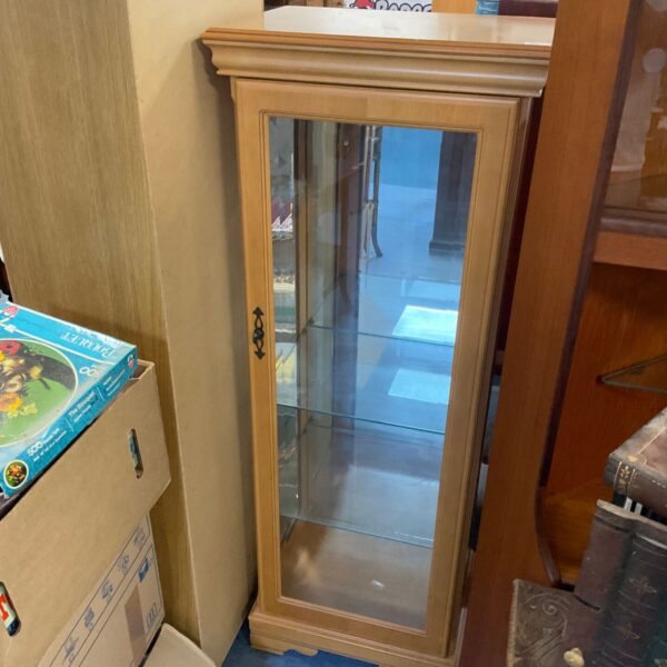 Beech effect illuminated display cabinet with glass shelves.