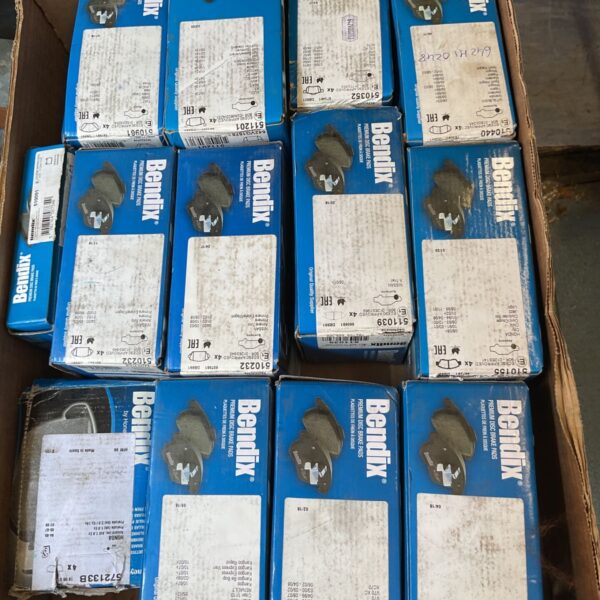 Crate of new old stock Bendix brake pads for various vehicles.