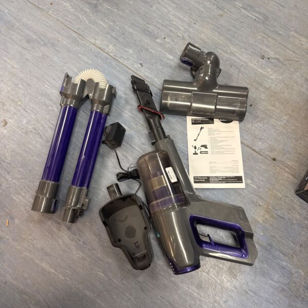 Purple and grey Bergstrom cordless vacuum cleaner with charger.