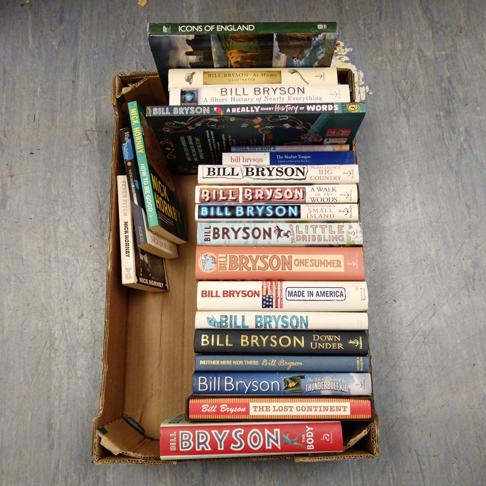Collection of Bill Bryson books, including travel and science titles.
