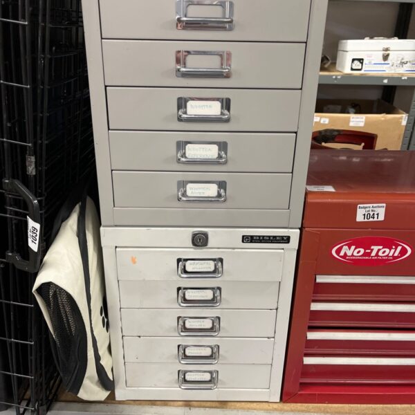 Pair of vintage metal Bisley filing cabinets for office storage.