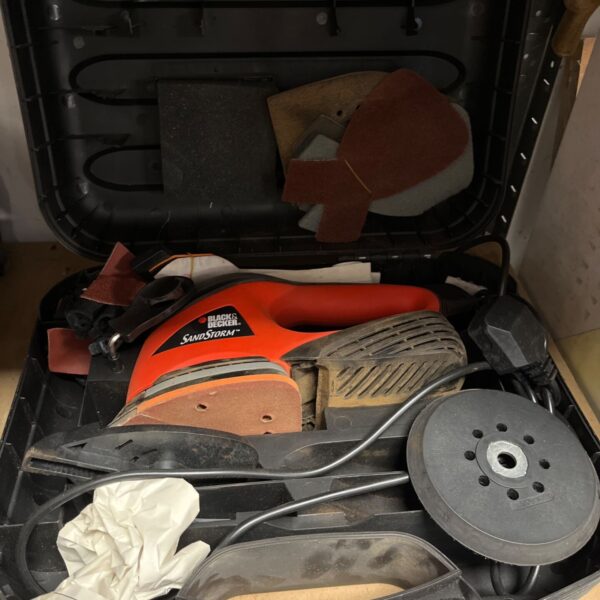 Black and Decker Sandstorm sander in open carry case.