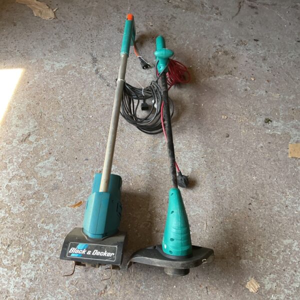 Black and Decker electric strimmer and hoe for garden maintenance.