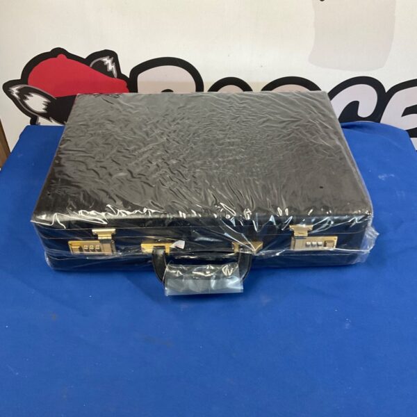 As new black briefcase with combination lock, front view.