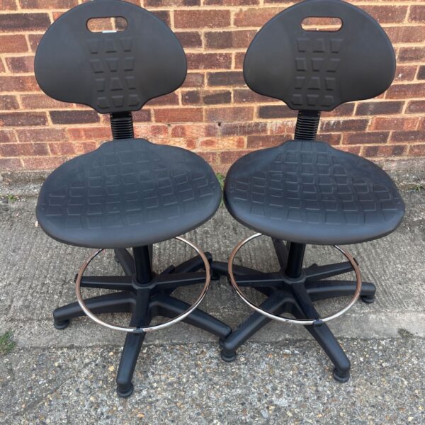 Black industrial draughtsman chair with chrome footring.