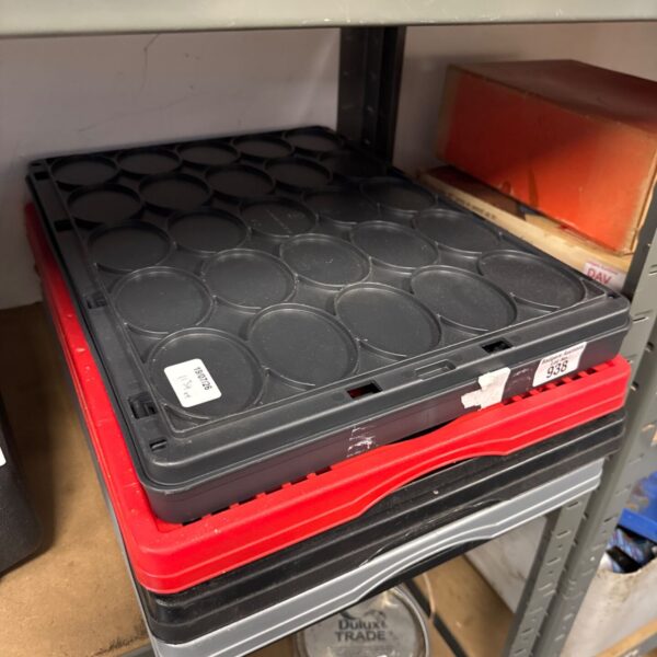 Black folding plastic storage crates stacked for easy storage.