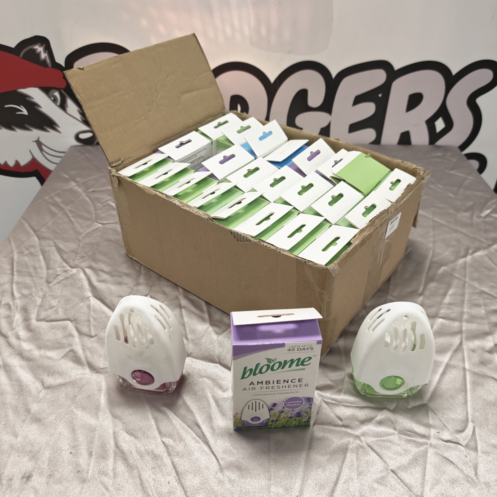 Box of unused Bloome ambience air fresheners with floral scent.