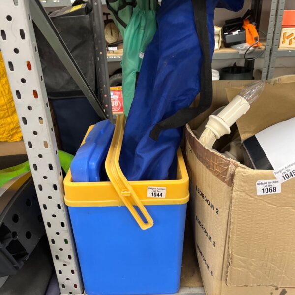 Blue cool box and two collapsible chairs in bags.