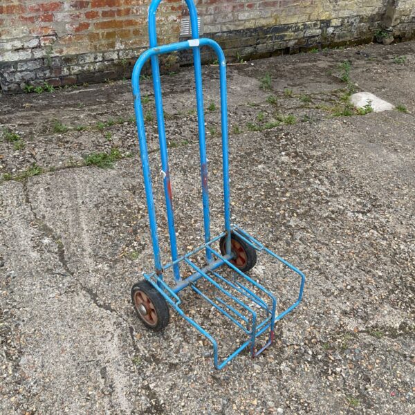 Blue folding trolley with wheels, ideal for heavy duty transport.