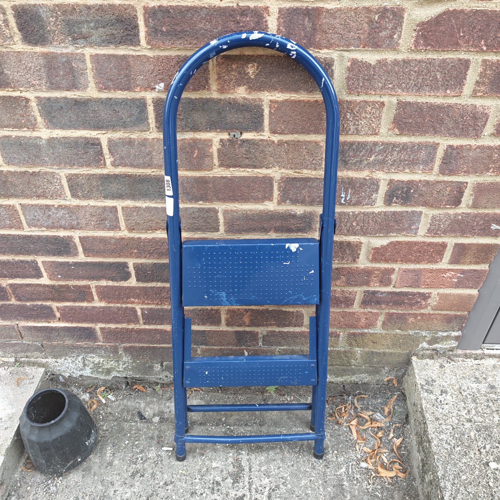 Vintage blue metal step ladder for home or garden use.