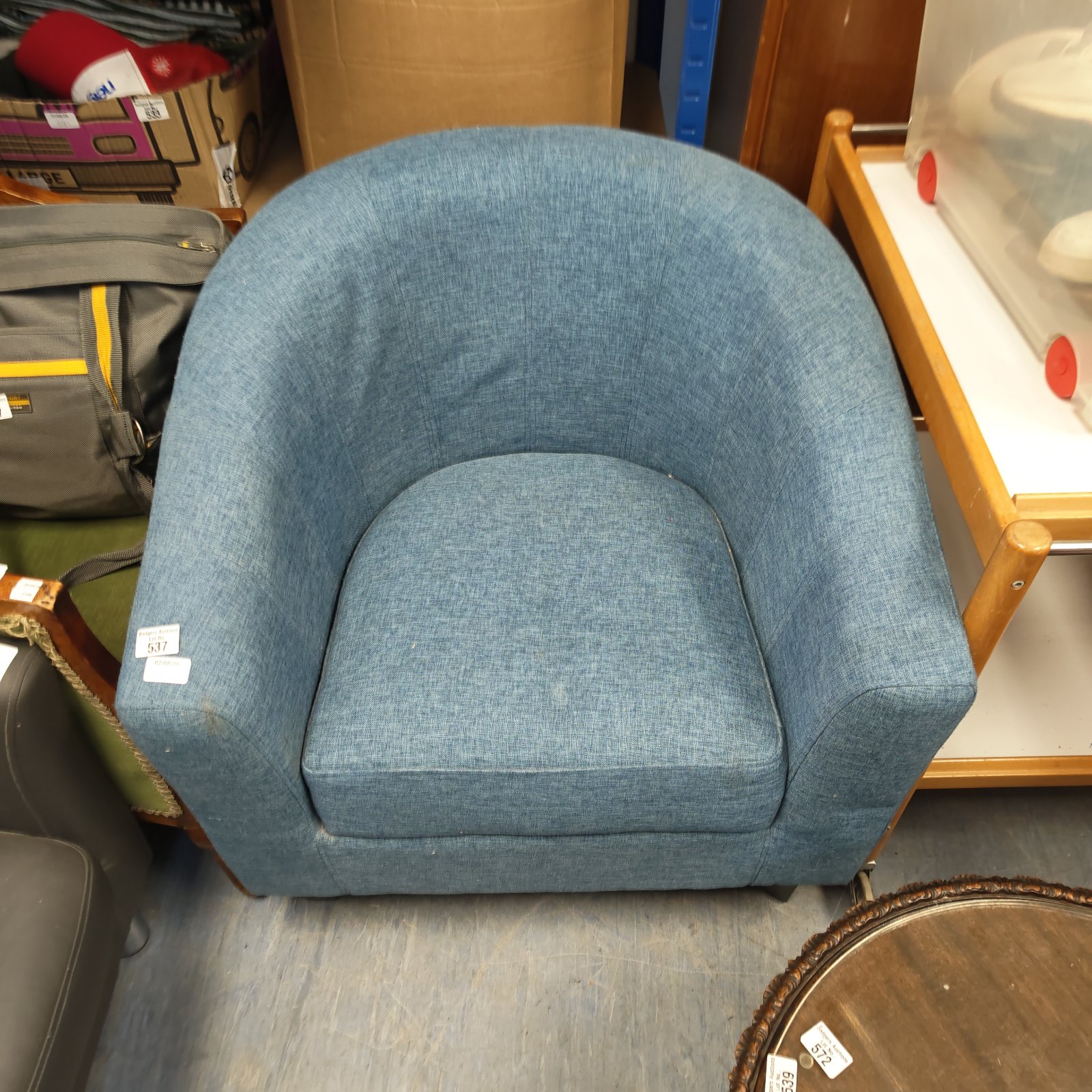 Vintage blue tub chair, comfortable retro seating.