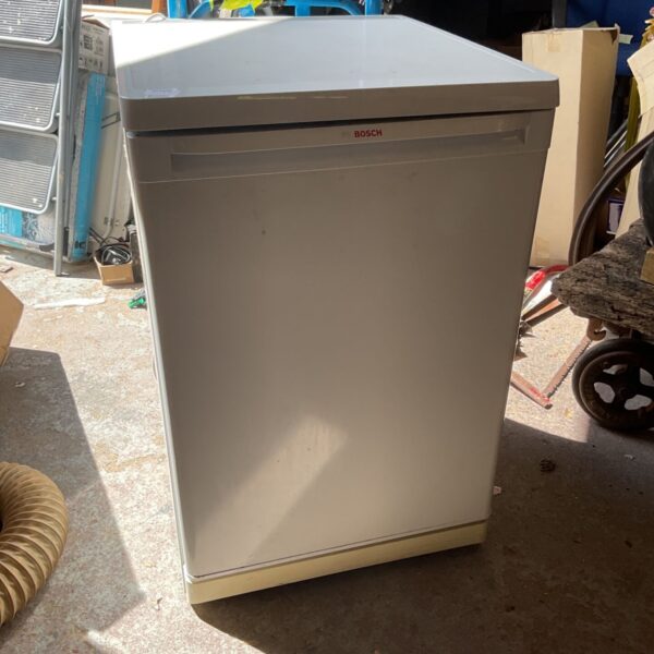 White Bosch fridge freezer in an auction setting.