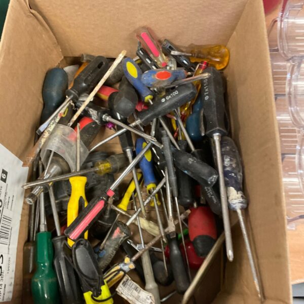 A box filled with a variety of vintage screwdrivers for DIY projects.