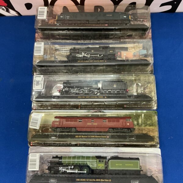 Vintage AmerCom OO gauge model railway trains in original packaging.