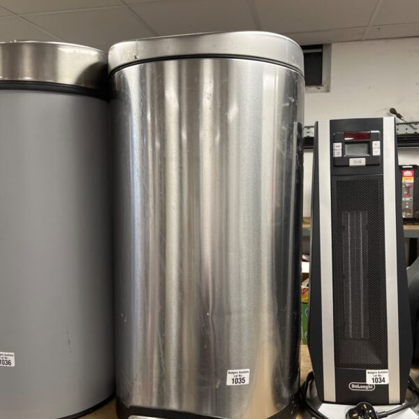 Stainless steel Brabantia pedal bin for kitchen waste disposal.