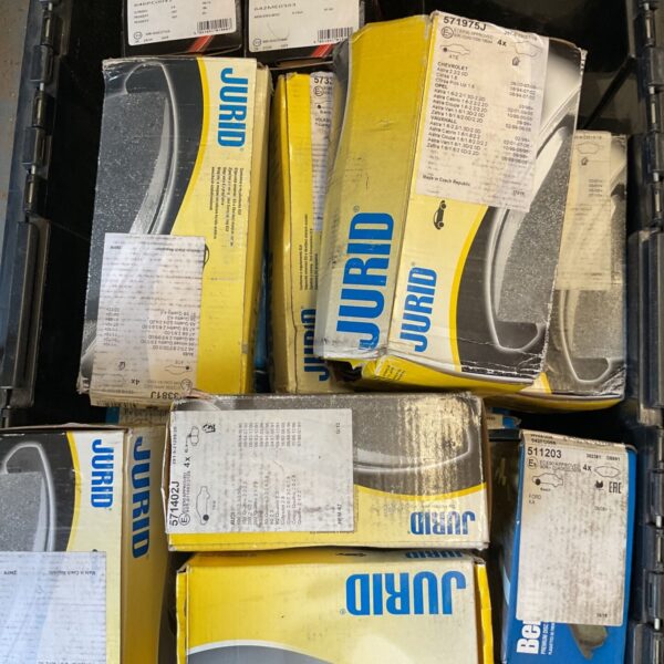 Crate of new old stock jurid and Drivetec brake pads for various vehicles.