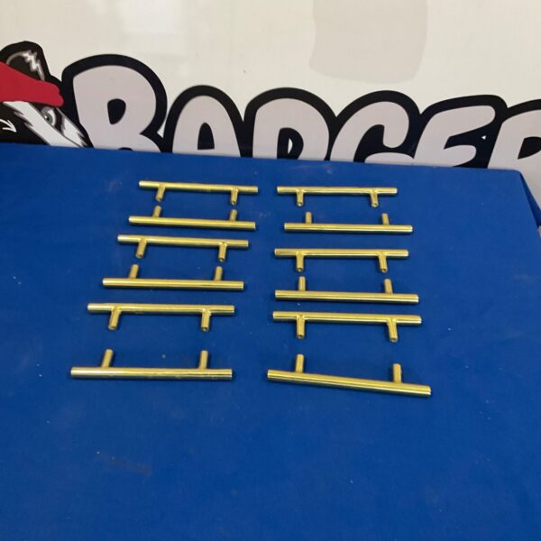 Lot of twelve vintage brass cupboard handles for cabinets.