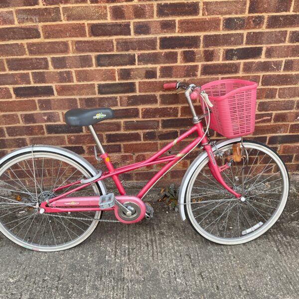 Vintage pink Bridgestone Happy Kirala children's bicycle with basket.