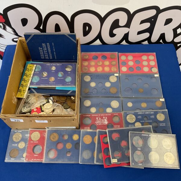 Vintage British coin collection displayed in a case.