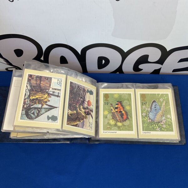 Vintage British stamps featuring butterflies and floral designs.