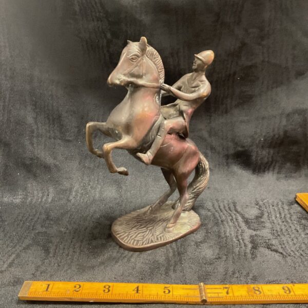 Vintage bronze rearing horse sculpture with rider.