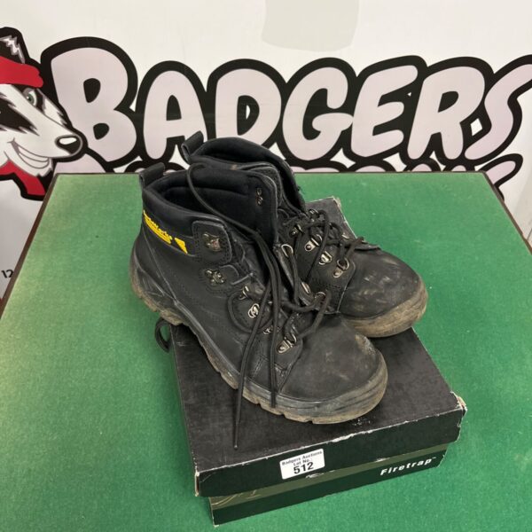Brown leather work boots showing wear and tear.