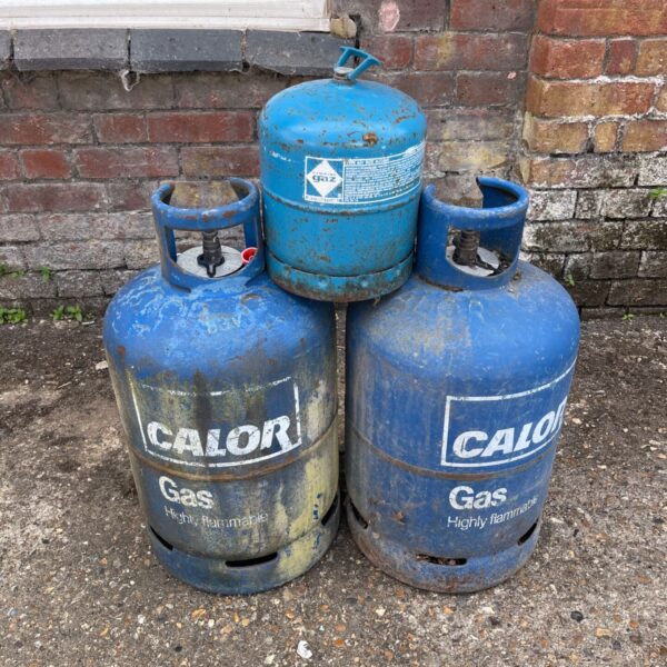 Three blue Calor Gas canisters stacked together.