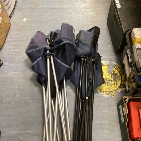 Pair of blue camping chairs with aluminium frames.