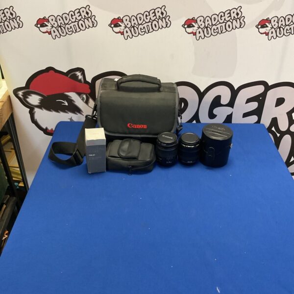 Canon DSLR camera kit with lens and carrying case.