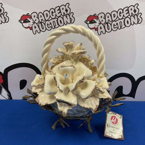 Vintage Capodimonte flower basket in brass bowl, detailed porcelain flowers.