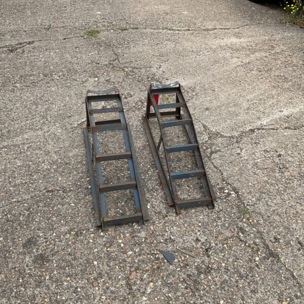 Pair of heavy duty car ramps for vehicle maintenance.