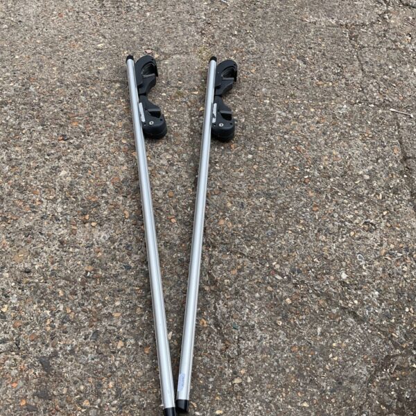 Set of used car roof bars for vehicle transport.
