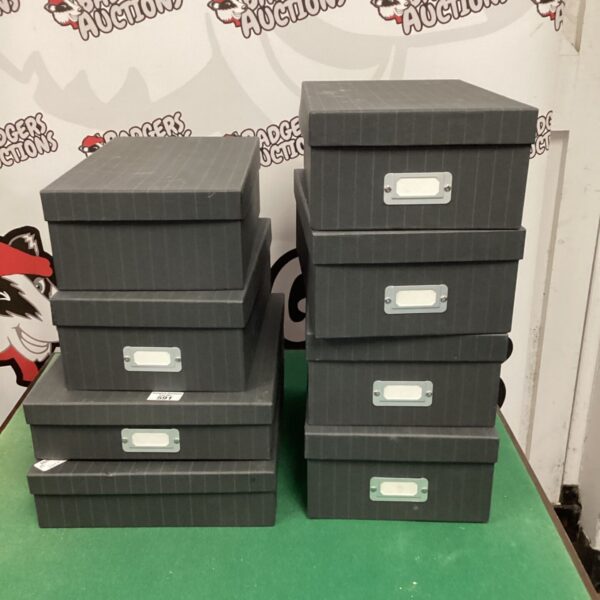 Lot of eight cardboard storage boxes with lids.