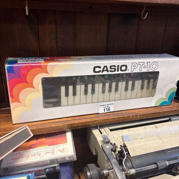 Vintage Casio PT-10 mini keyboard in used condition.