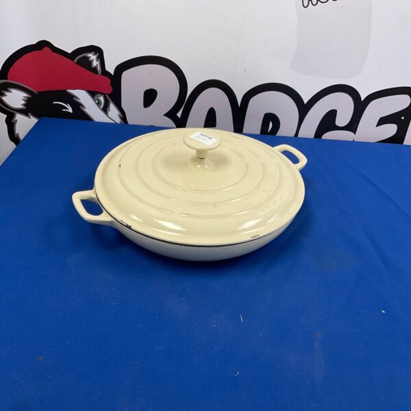 Cream enamel cast iron cooking pot with lid.