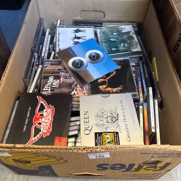 Large CD collection including Queen and Fleetwood Mac albums.