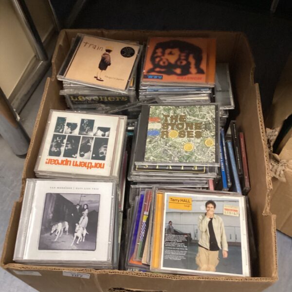 Large CD collection including Van Morrison and The Stone Roses albums.